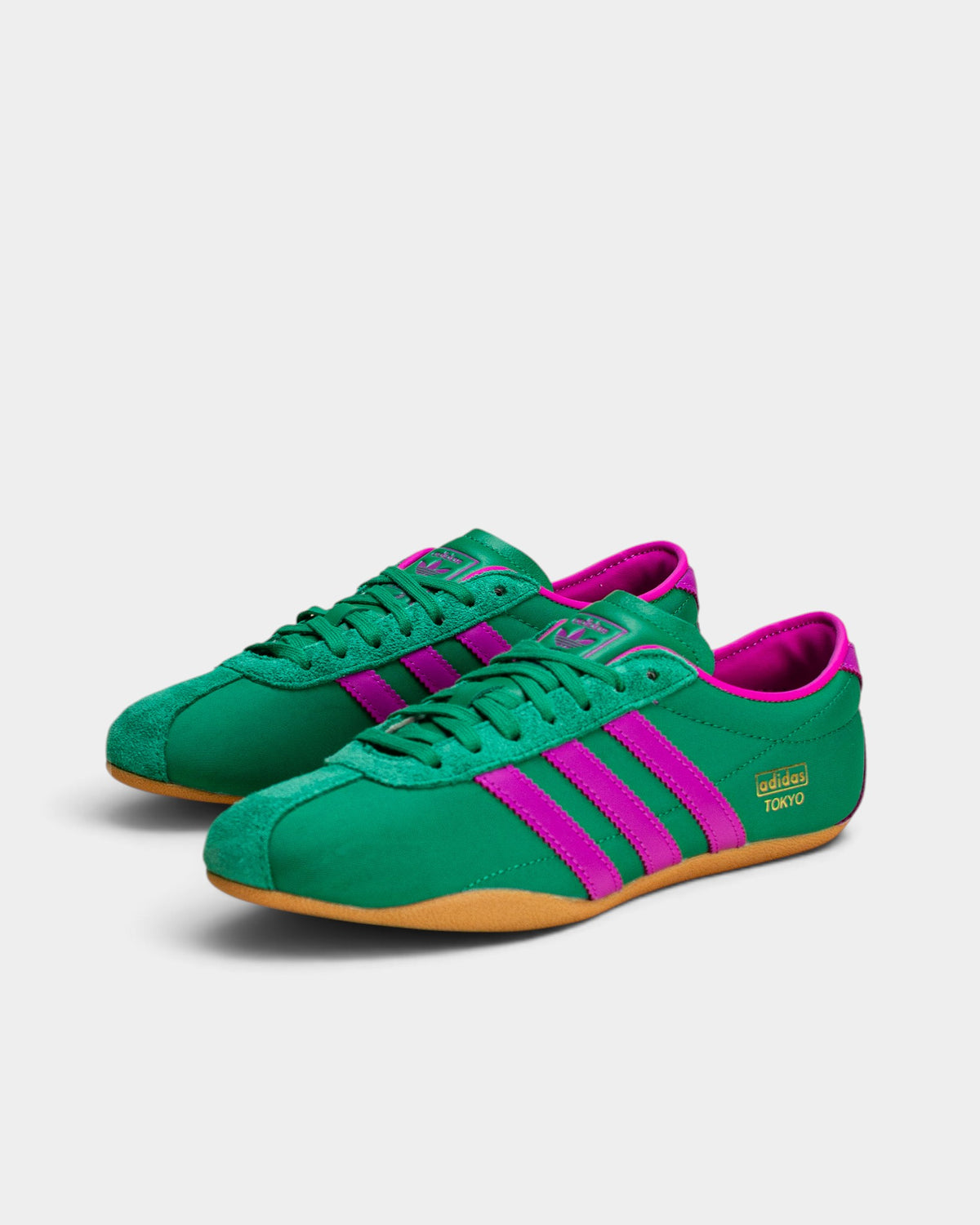 Lockwood Avenue adidas Tokyo women's sneakers in court green nylon with purple stripes and a gum rubber outsole.