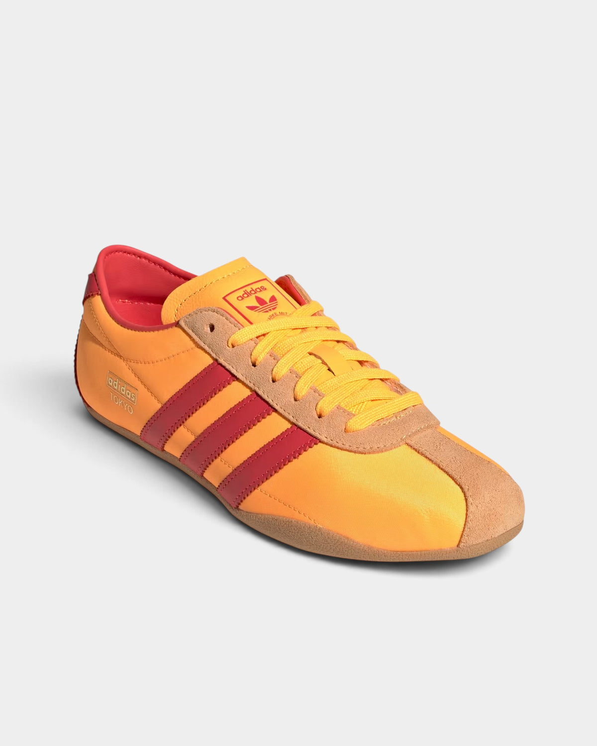 Lockwood Avenue adidas Tokyo retro running shoes in tangerine orange and red nylon with gold metallic accents.