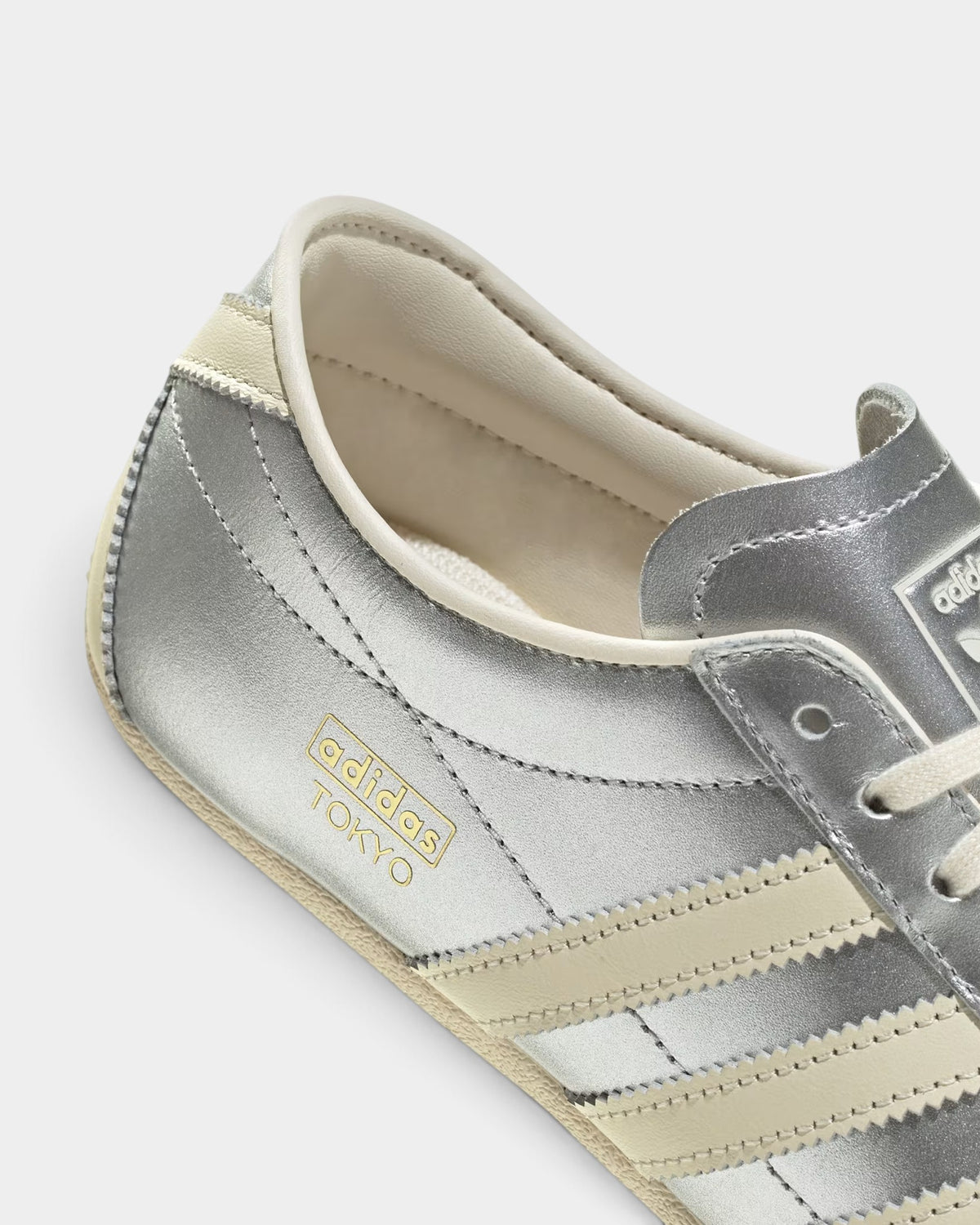 Lockwood Avenue adidas Tokyo W women's sneaker in metallic silver nylon and suede with cream and gold accents.