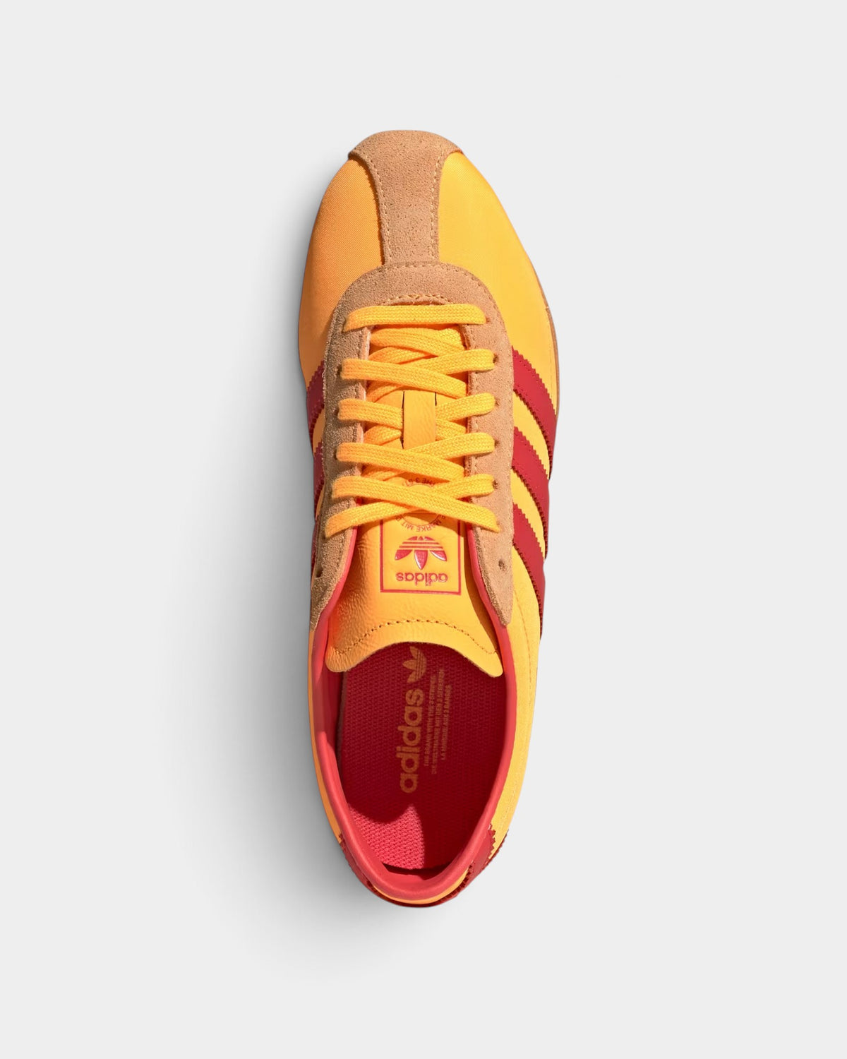 Lockwood Avenue adidas Tokyo retro running shoes in tangerine, red, and gold with a lightweight nylon upper.