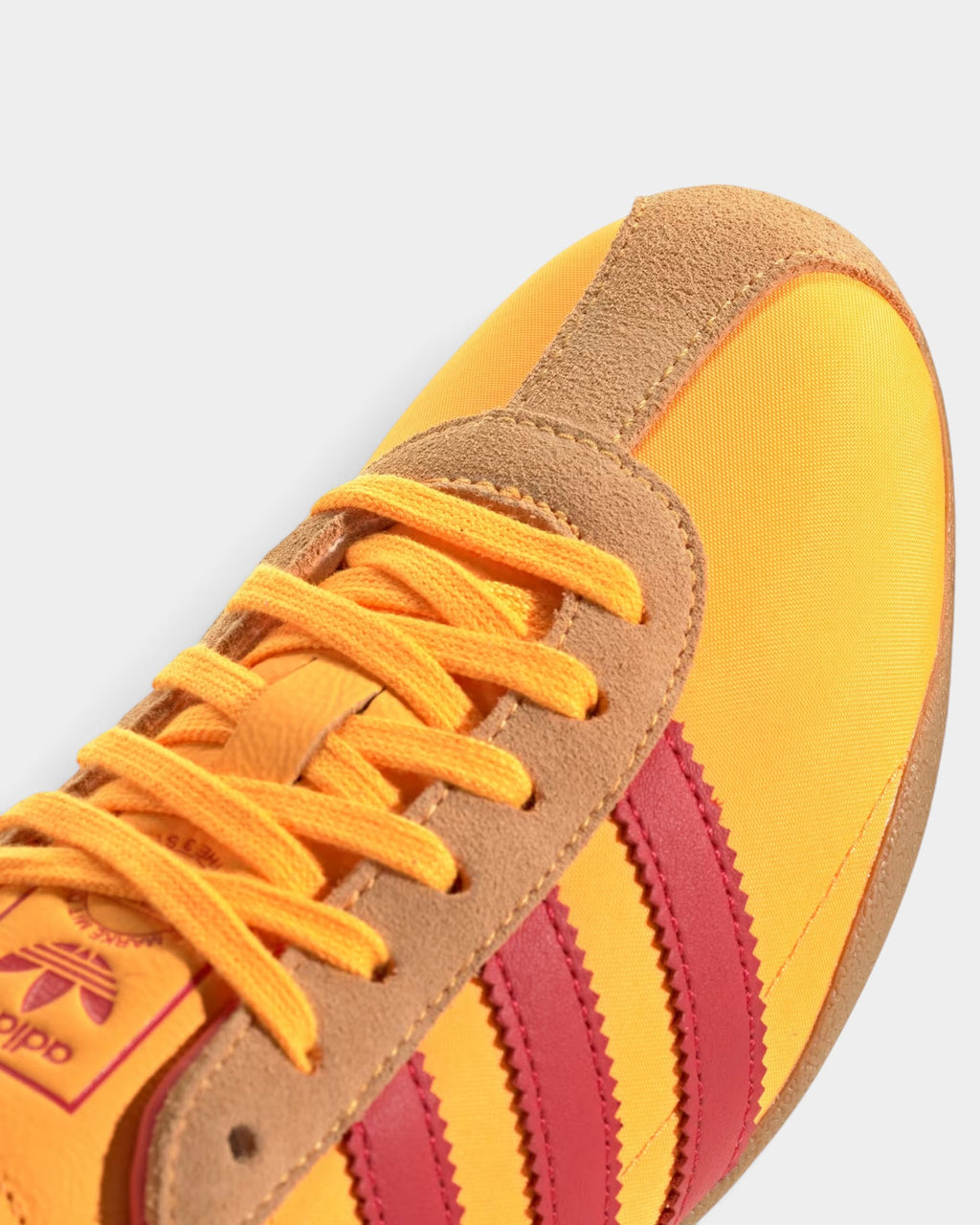 Lockwood Avenue adidas Tokyo retro running shoe in tangerine nylon with red stripes and gold metallic accents