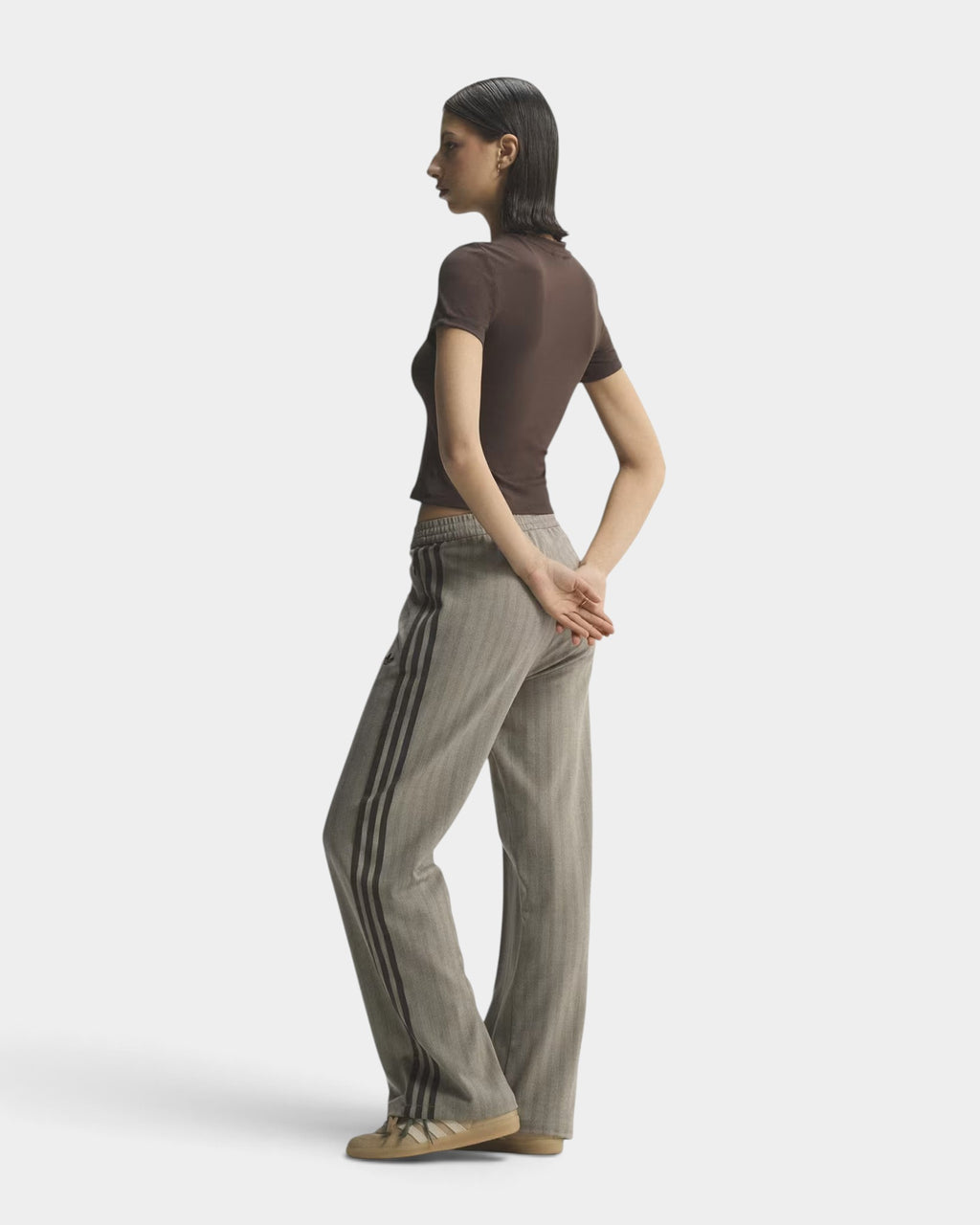 Lockwood Avenue adidas OG tweed track pants in grey herringbone knit with side stripes worn by a model in profile