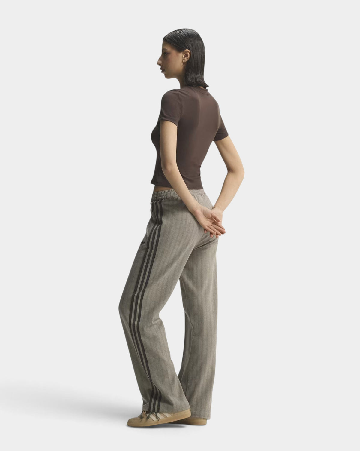Lockwood Avenue adidas OG tweed track pants in grey herringbone knit with side stripes worn by a model in profile