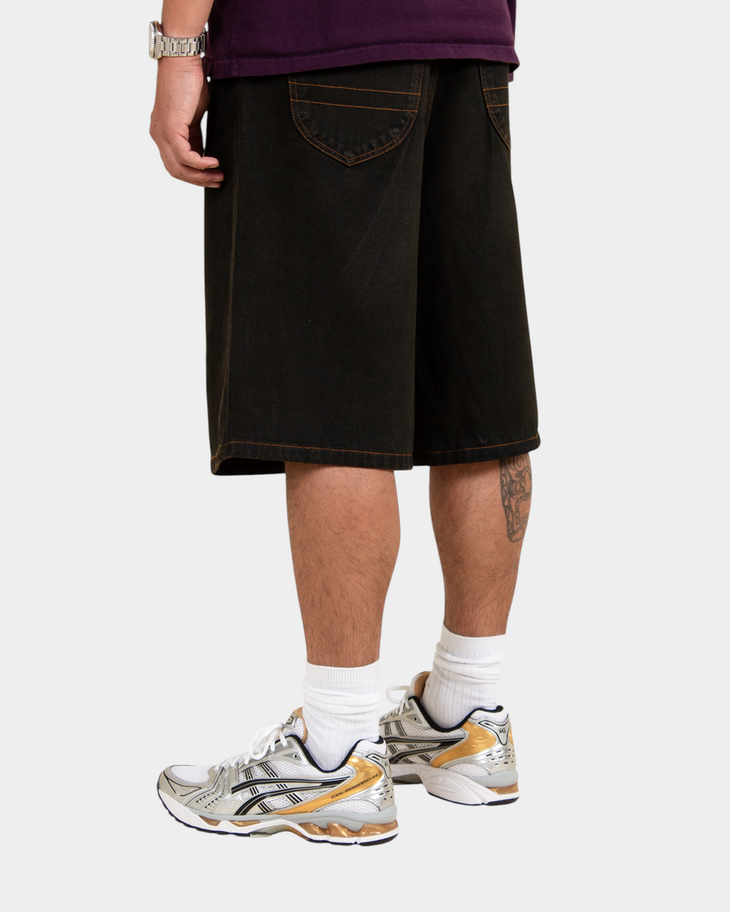Lockwood Avenue baggy denim shorts in overdye black cotton with angular back pockets and contrast stitching