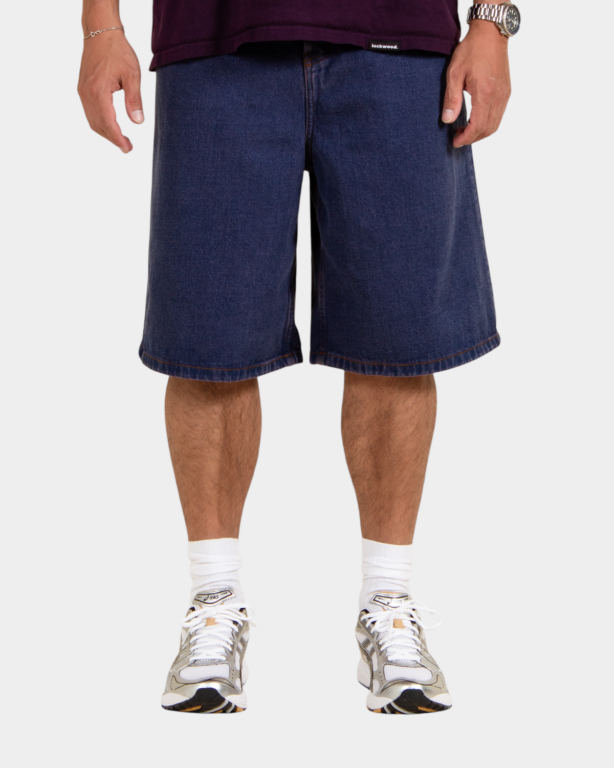 Lockwood Avenue baggy denim shorts in dark blue overdye cotton with a loose fit worn by a model
