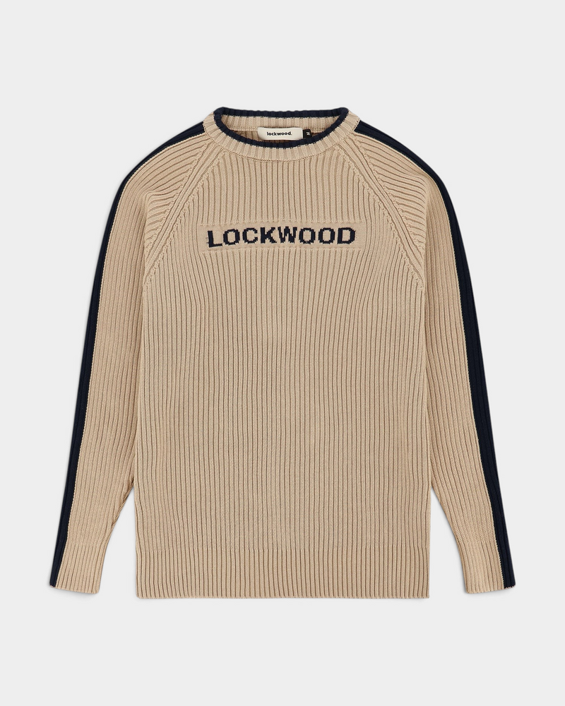 Lockwood Avenue Y2K rib knit cotton sweater in beige with navy blue logo and sleeve stripe details.
