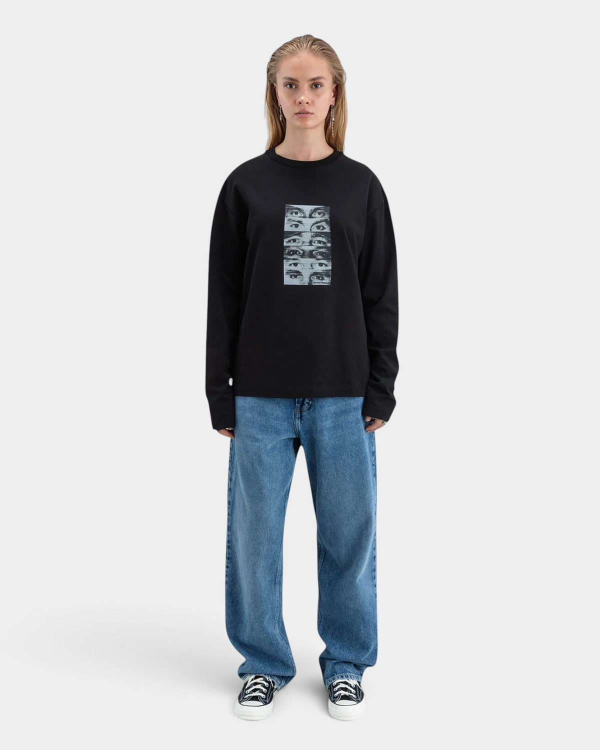 Lockwood Avenue Beyond Medals black long-sleeve cotton t-shirt featuring a halftone eye graphic on the chest.