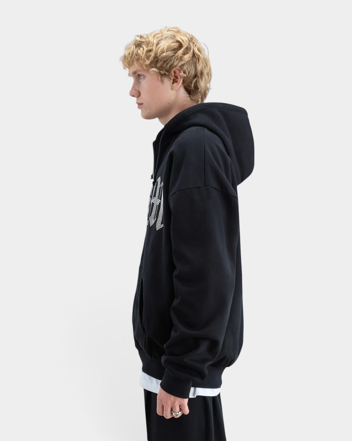 Lockwood Avenue Beyond Medals black heavyweight cotton zip hoodie with rhinestone logo, side profile view