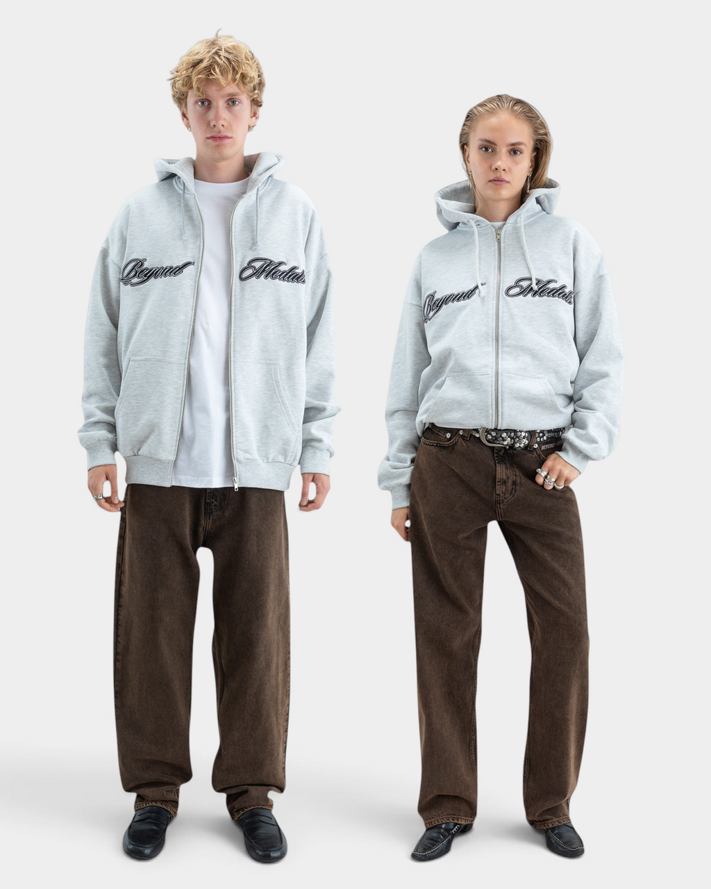Lockwood Avenue Beyond Medals grey zip hoodie with black embroidered script logo worn by male and female models
