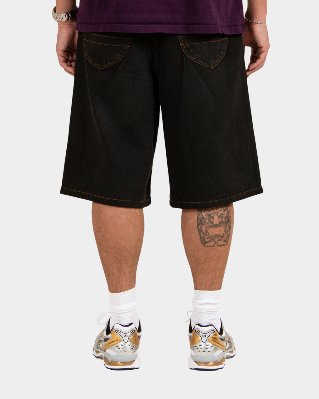 Lockwood Avenue baggy denim shorts in black overdye cotton with angular back pockets and contrast stitching