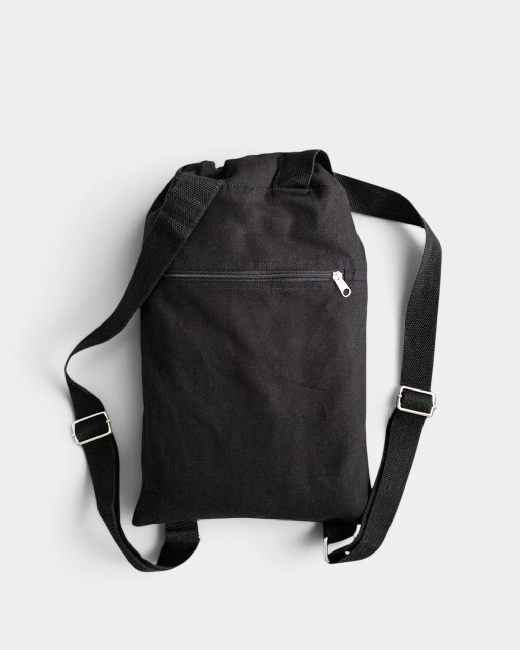 Lockwood Avenue Poetic Collective black cotton canvas daypack with adjustable shoulder straps and a zippered pocket.