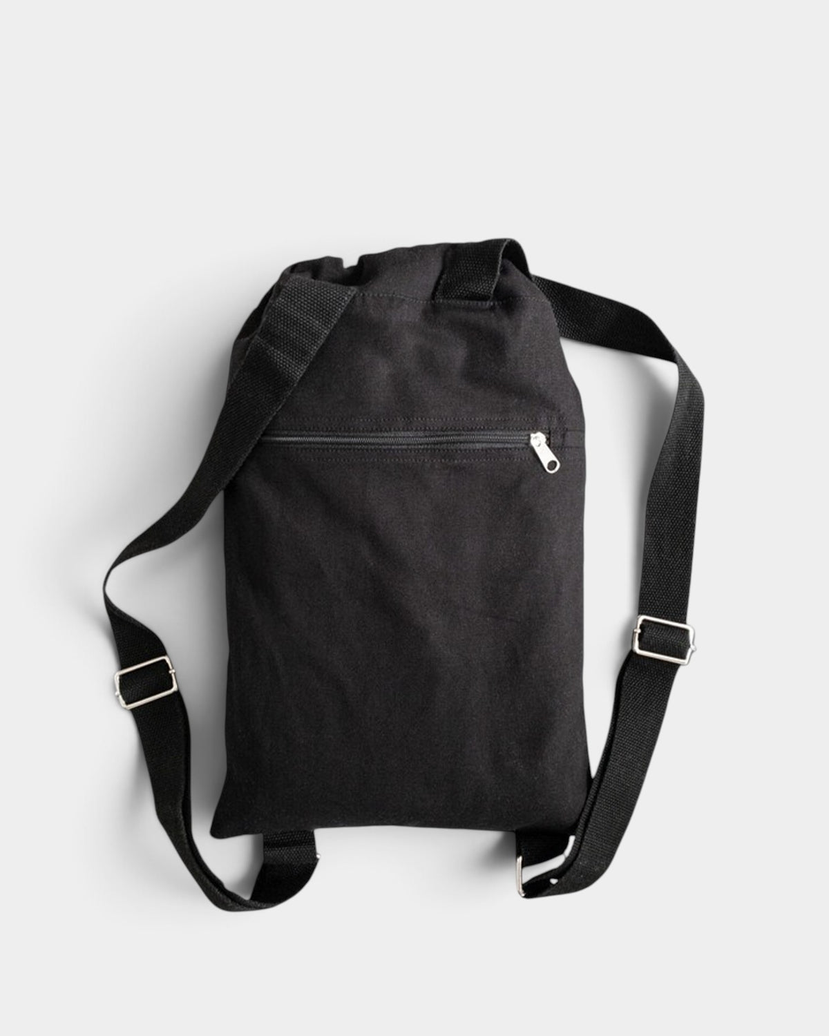 Lockwood Avenue Poetic Collective black cotton canvas daypack with adjustable shoulder straps and a zippered pocket.