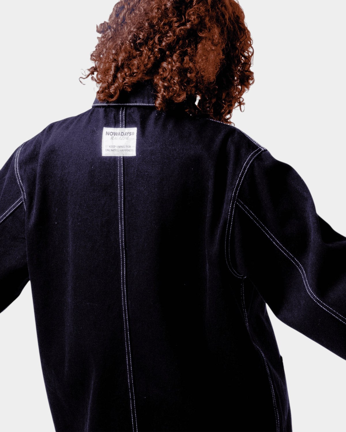 Lockwood Avenue black denim chore jacket with white contrast stitching and Nowadays Magazine label on the back