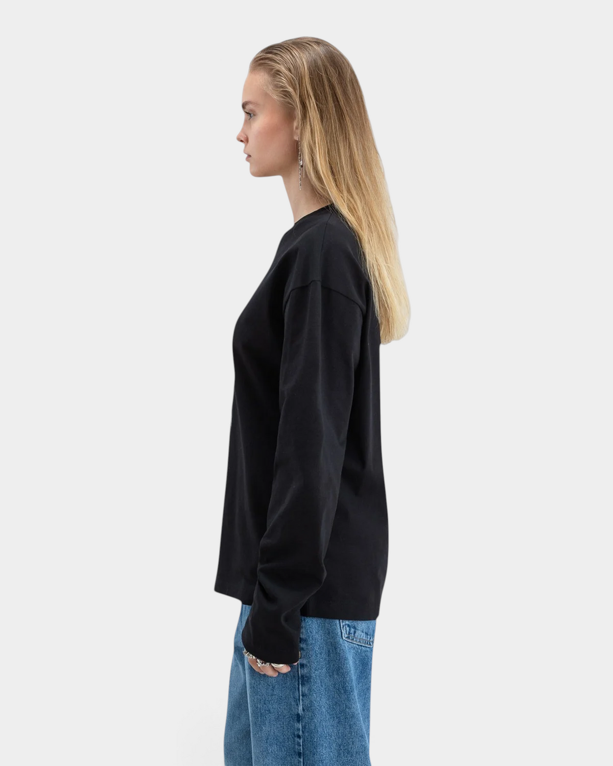 Lockwood Avenue Beyond Medals black long-sleeve cotton t-shirt with halftone eye print on chest, side view