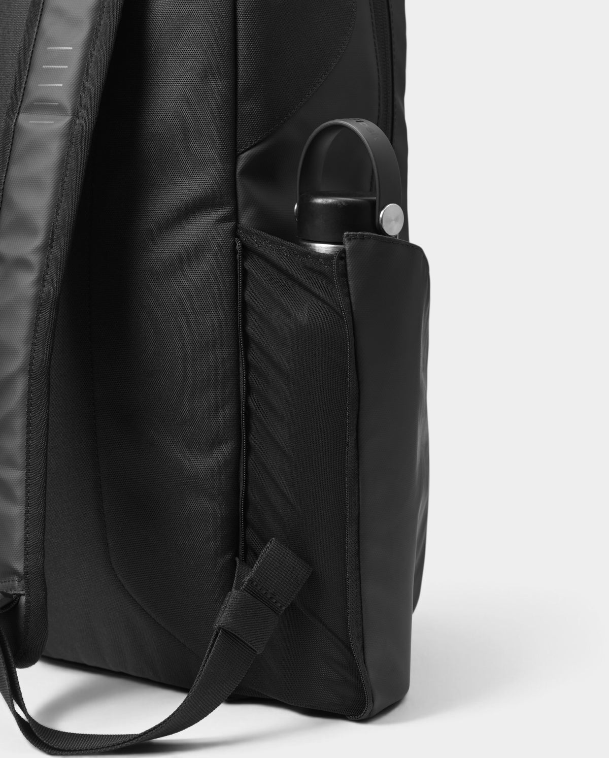 Lockwood Avenue black 20L daypack featuring a reinforced side water bottle pocket and durable Rib-Cage construction.