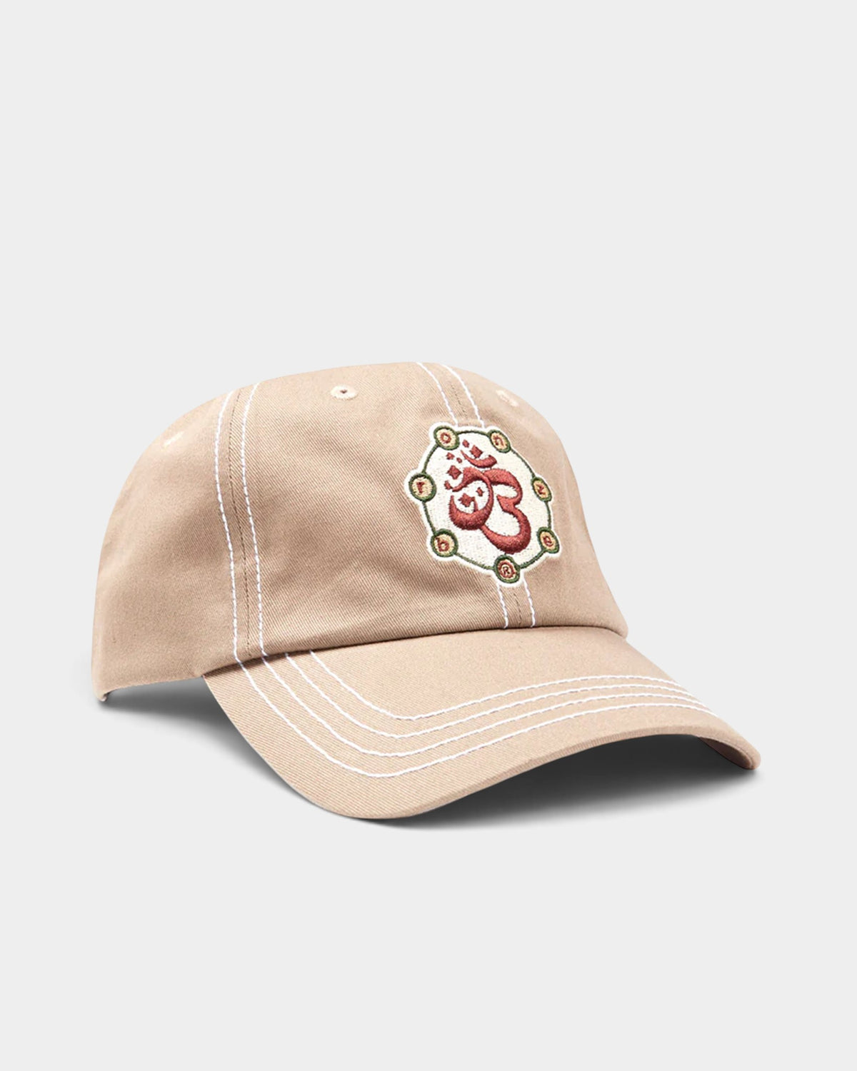Lockwood Avenue Bronze 56k Shakra cap in tan cotton twill with white contrast stitching and embroidered front graphic