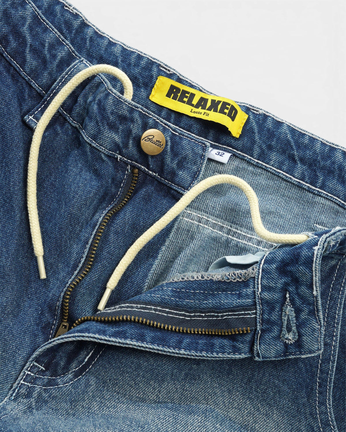 Lockwood Avenue Butter Goods Alpine relaxed fit blue denim jeans featuring an internal drawstring and yellow label