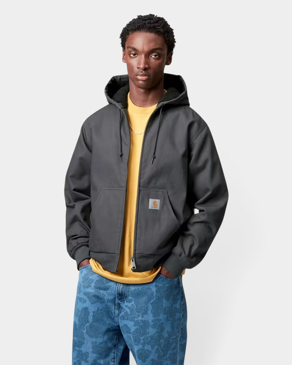 Lockwood Avenue Carhartt Active winter jacket in charcoal grey canvas with hood, kangaroo pocket, and square label.