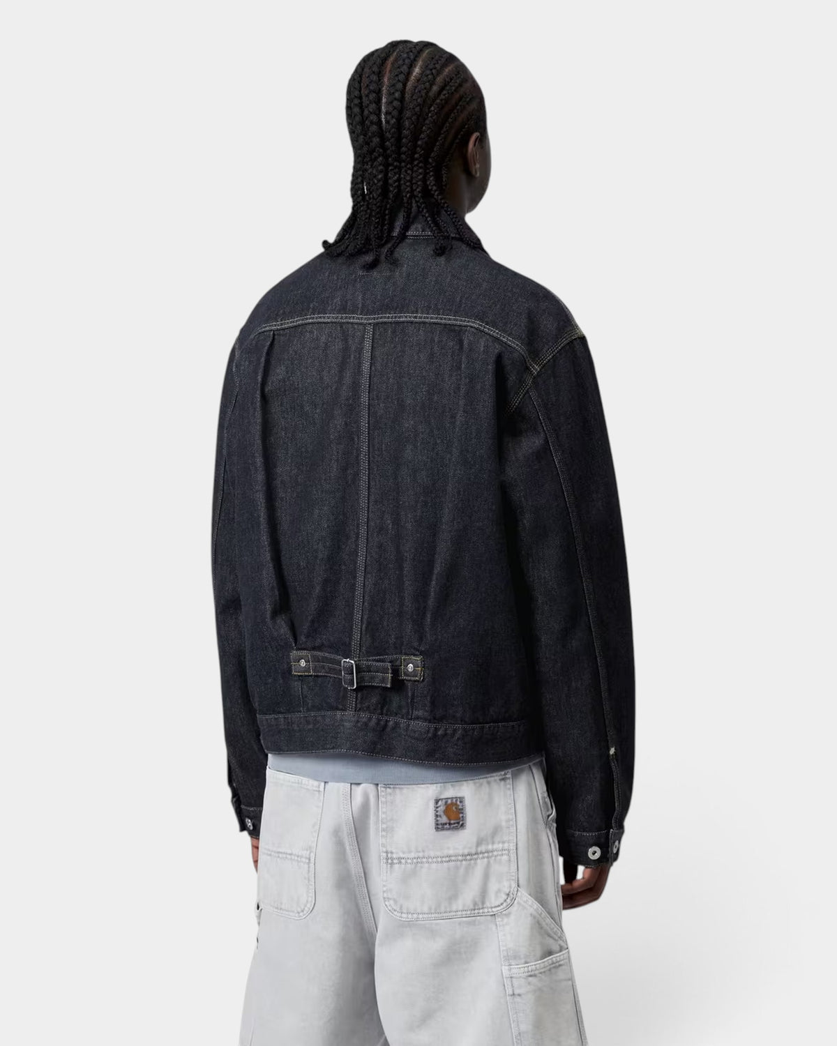Lockwood Avenue Carhartt Belmar jacket in dark denim with buttoned back strap, worn by a model from the back view