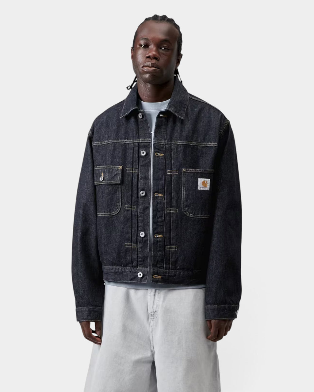 Lockwood Avenue Carhartt Belmar dark denim jacket with chest pockets and square label on a model
