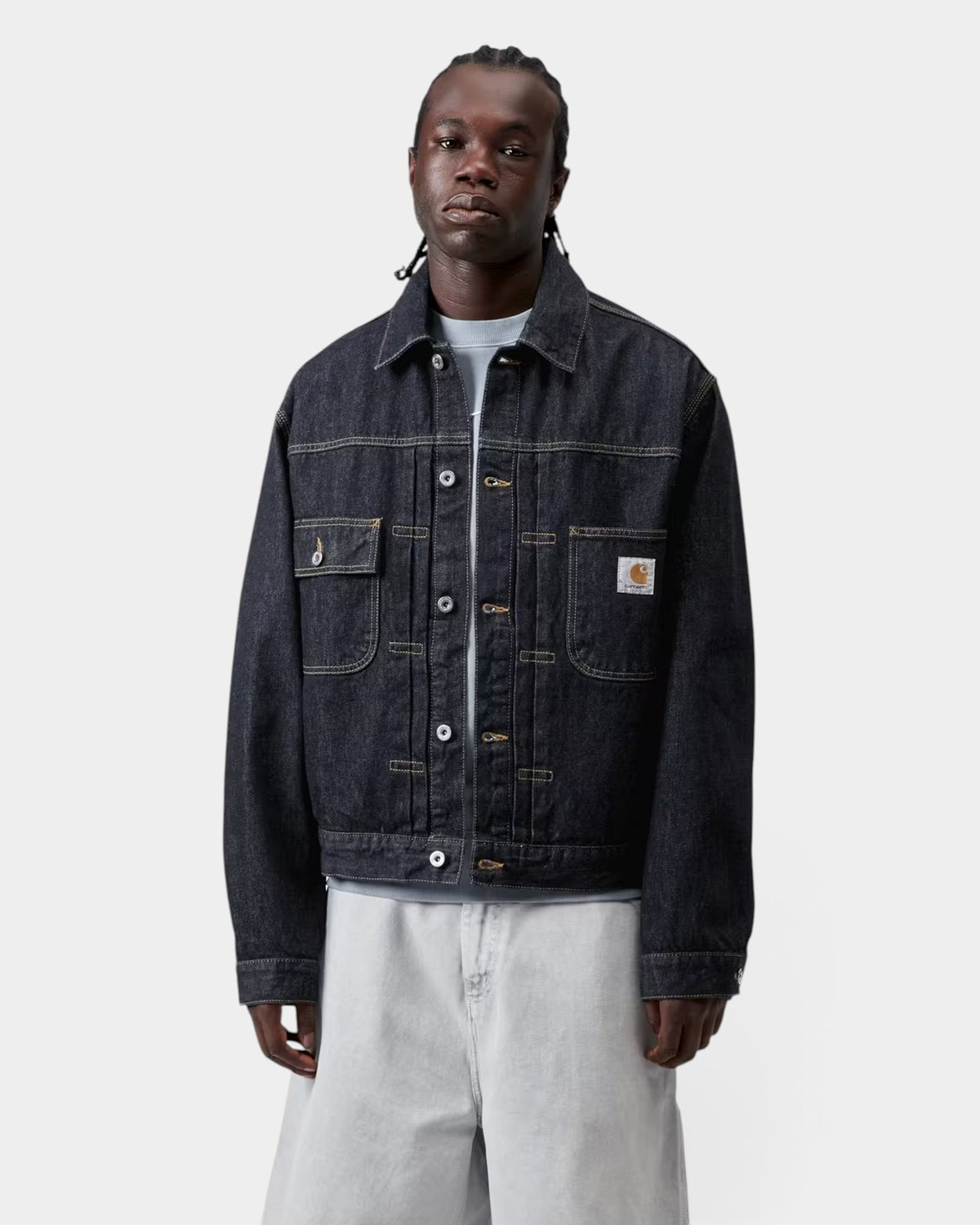 Lockwood Avenue Carhartt Belmar dark denim jacket with chest pockets and square label on a model