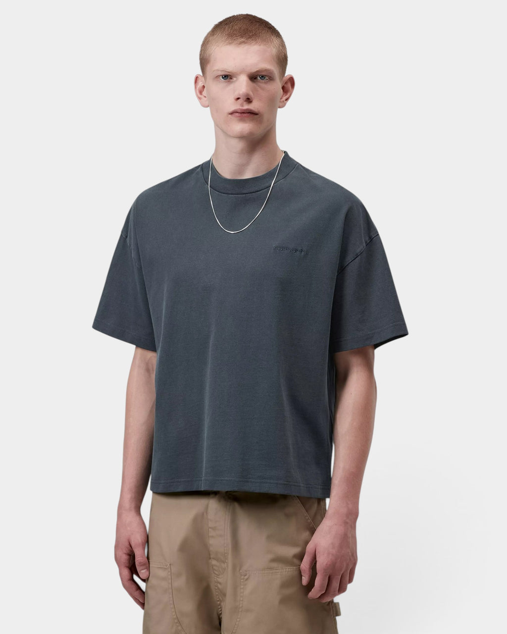 Lockwood Avenue model wearing a loose fit charcoal grey garment-dyed cotton Carhartt Benton T-Shirt with script logo