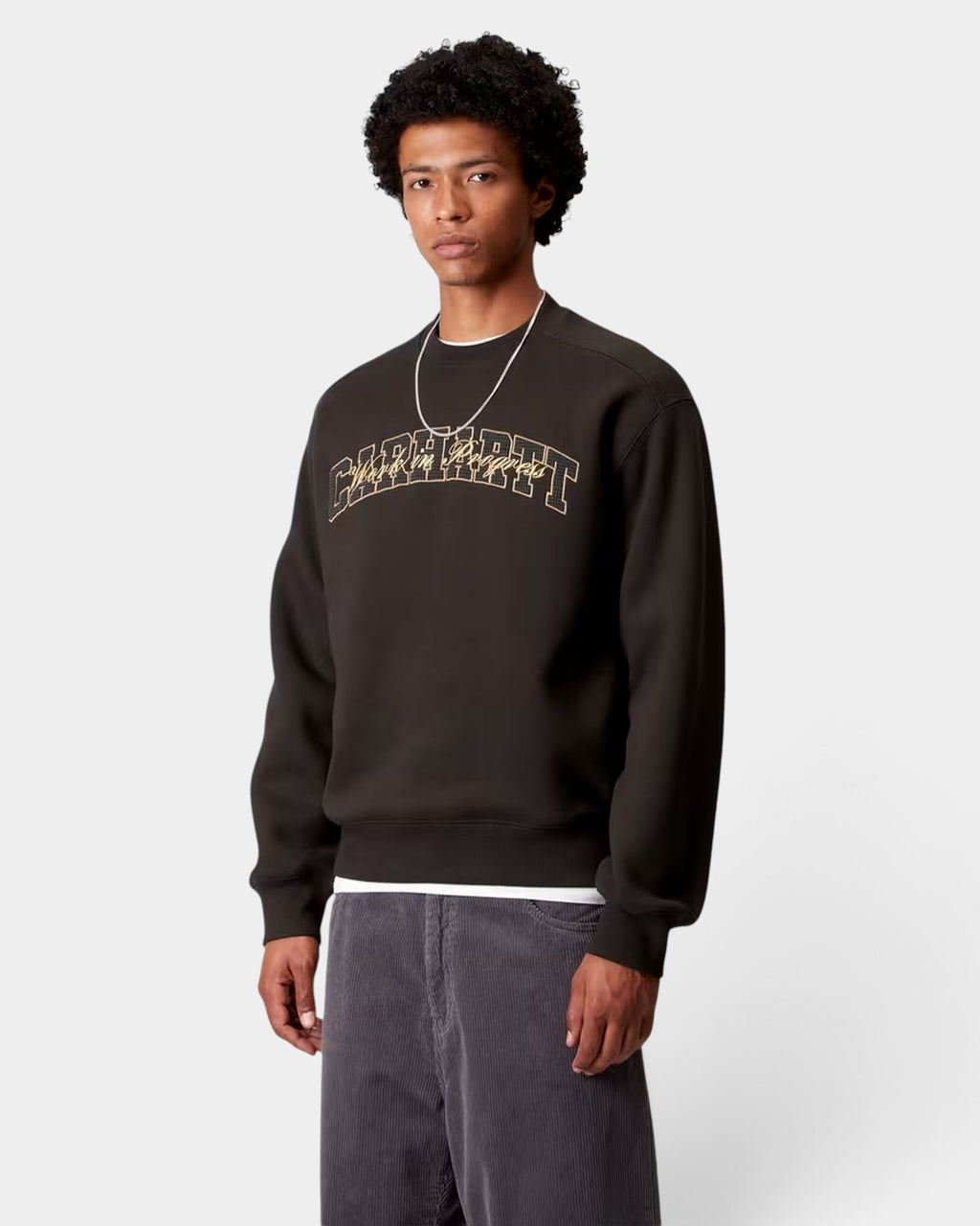 Lockwood Avenue Carhartt black balloon fit crewneck sweatshirt with gold embroidered graphic on chest worn by model