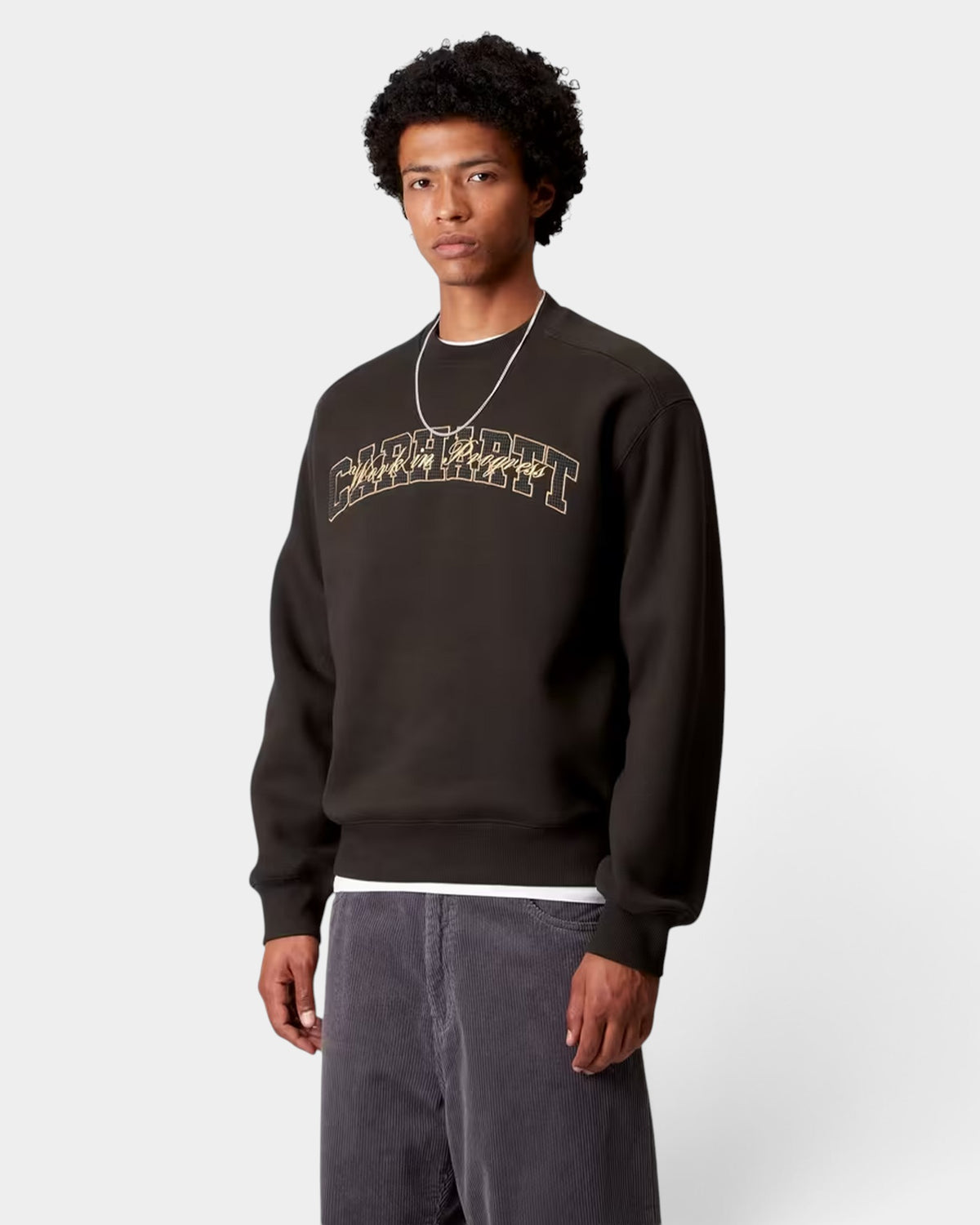 Lockwood Avenue Carhartt black balloon fit crewneck sweatshirt with gold embroidered graphic on chest worn by model