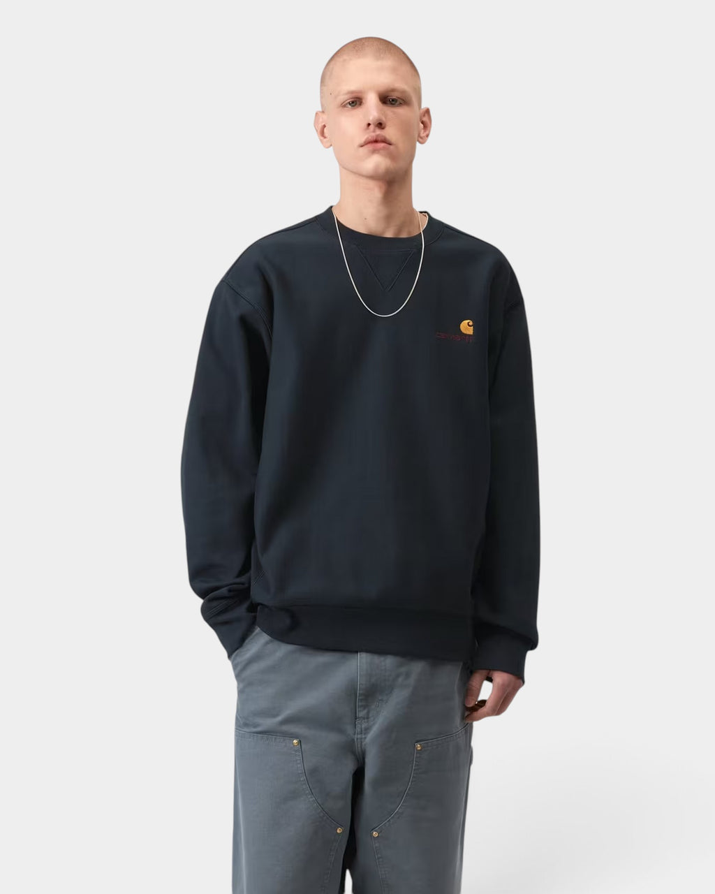 Lockwood Avenue Carhartt American Script black crewneck sweatshirt with embroidered chest logo on a male model