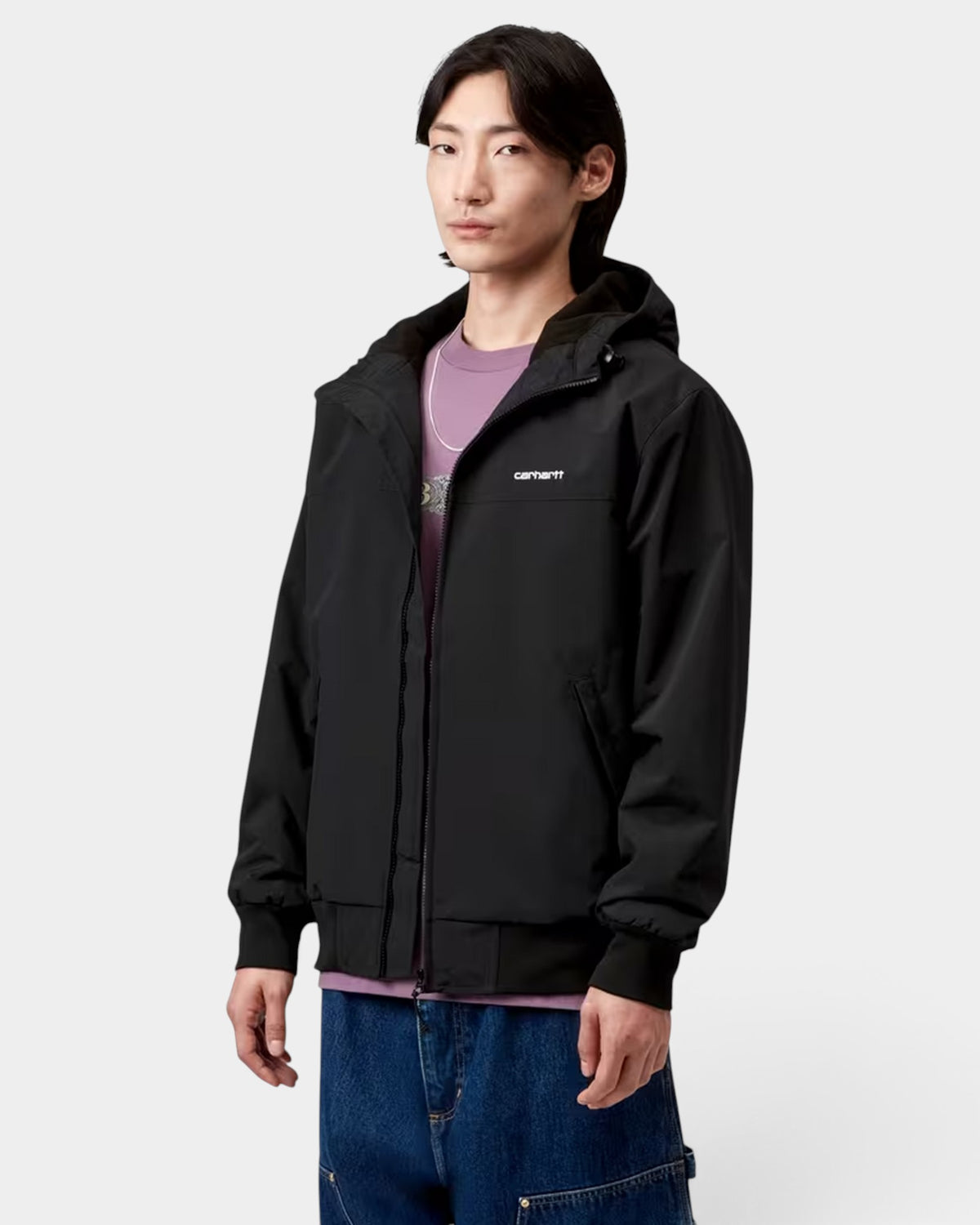 Lockwood Avenue Carhartt Hooded Sail Jacket in black nylon with fleece lining, hood, and ribbed cuffs on a model
