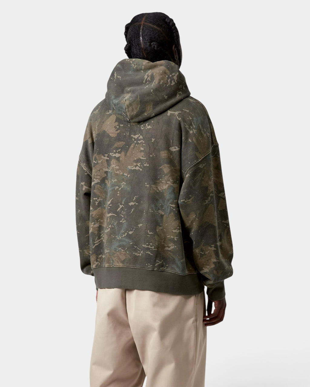 Back view of a person wearing a Lockwood Avenue Carhartt hooded camo print sweatshirt in a loose boxy fit
