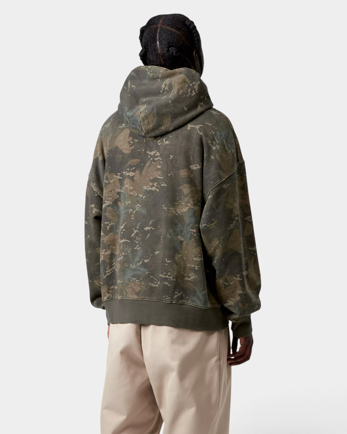 Back view of a person wearing a Lockwood Avenue Carhartt hooded camo print sweatshirt in a loose boxy fit