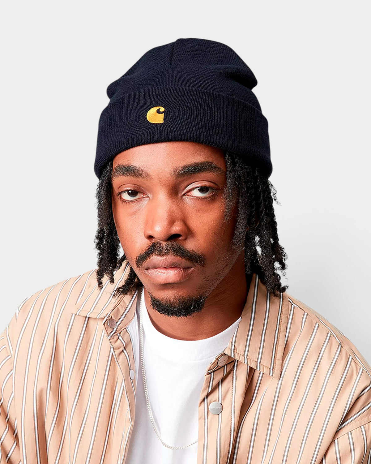 Lockwood Avenue Carhartt Chase Beanie in navy blue acrylic rib knit with gold embroidered C logo on the cuff