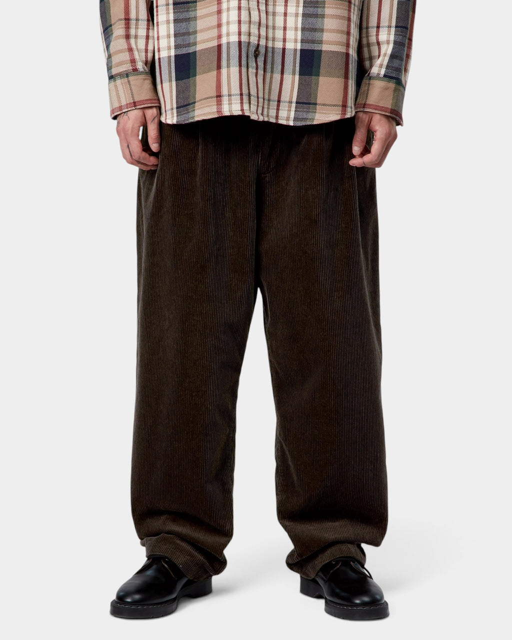 Lockwood Avenue Carhartt Evan dark brown corduroy trousers featuring a loose tapered fit and double front pleats.