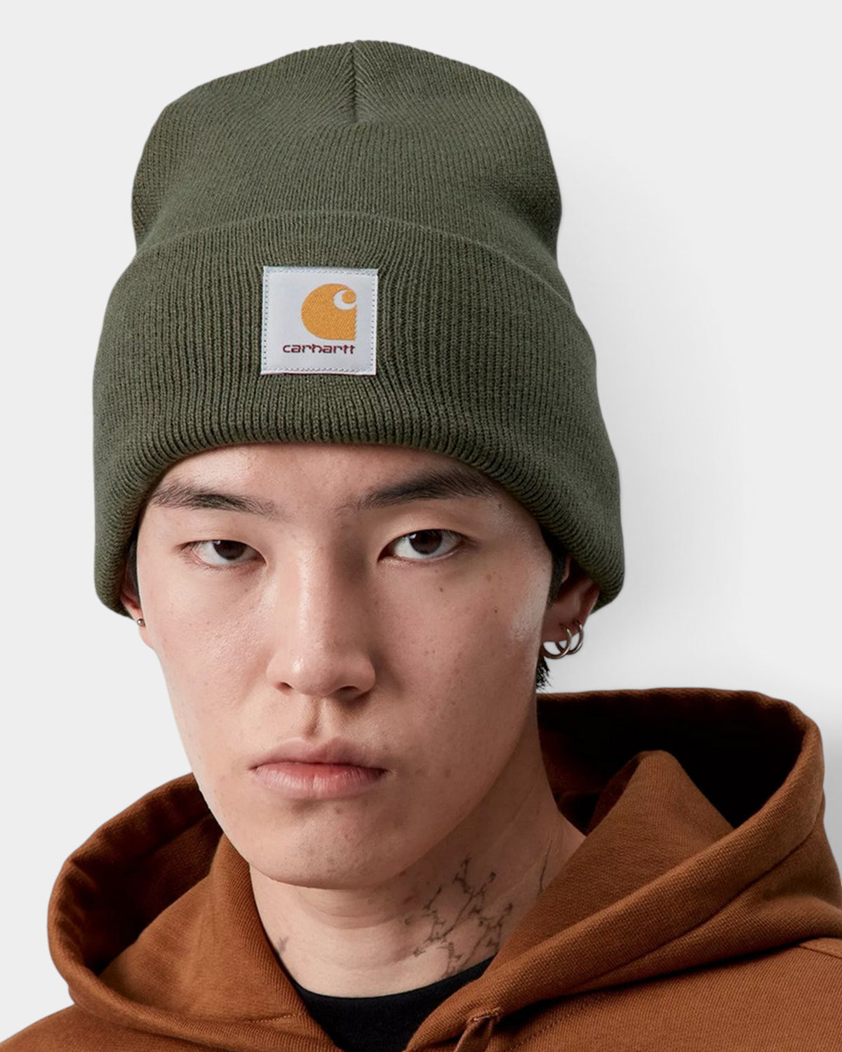Lockwood Avenue Carhartt acrylic watch beanie in opuntia green with a fold-up cuff and woven logo label on a model.