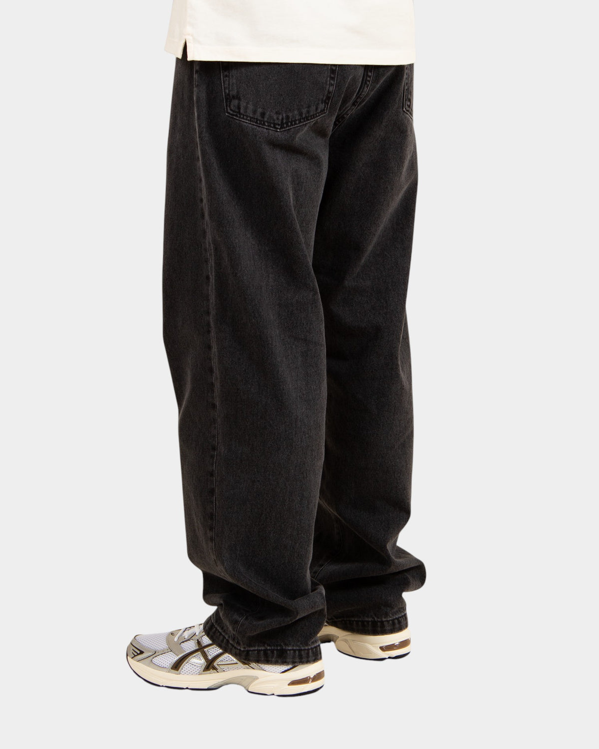 Lockwood Avenue Carhartt Landon stone-washed black denim pants with a loose tapered fit worn by a model