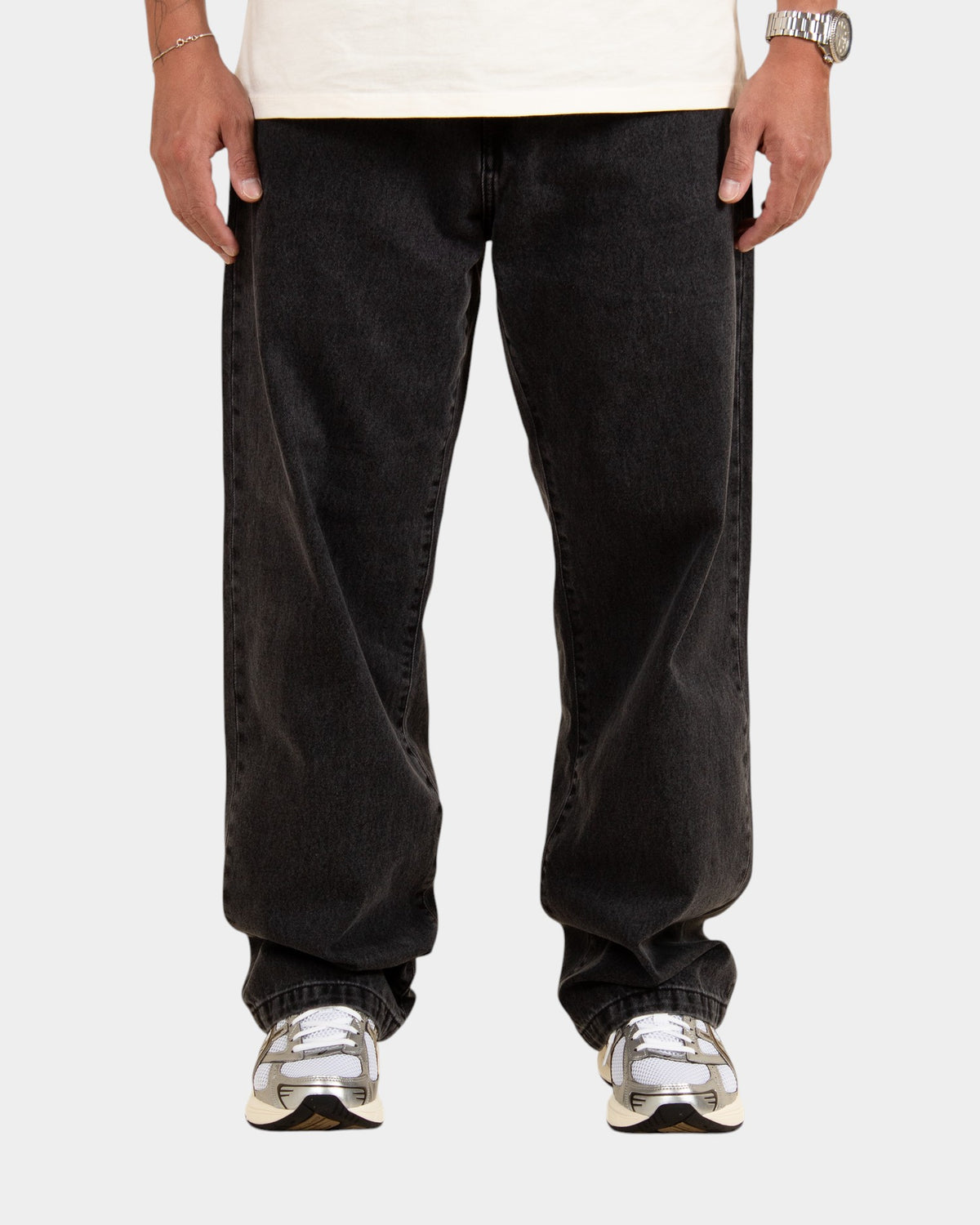 Lockwood Avenue Carhartt Landon stone-washed black denim pants in a loose tapered fit on a model