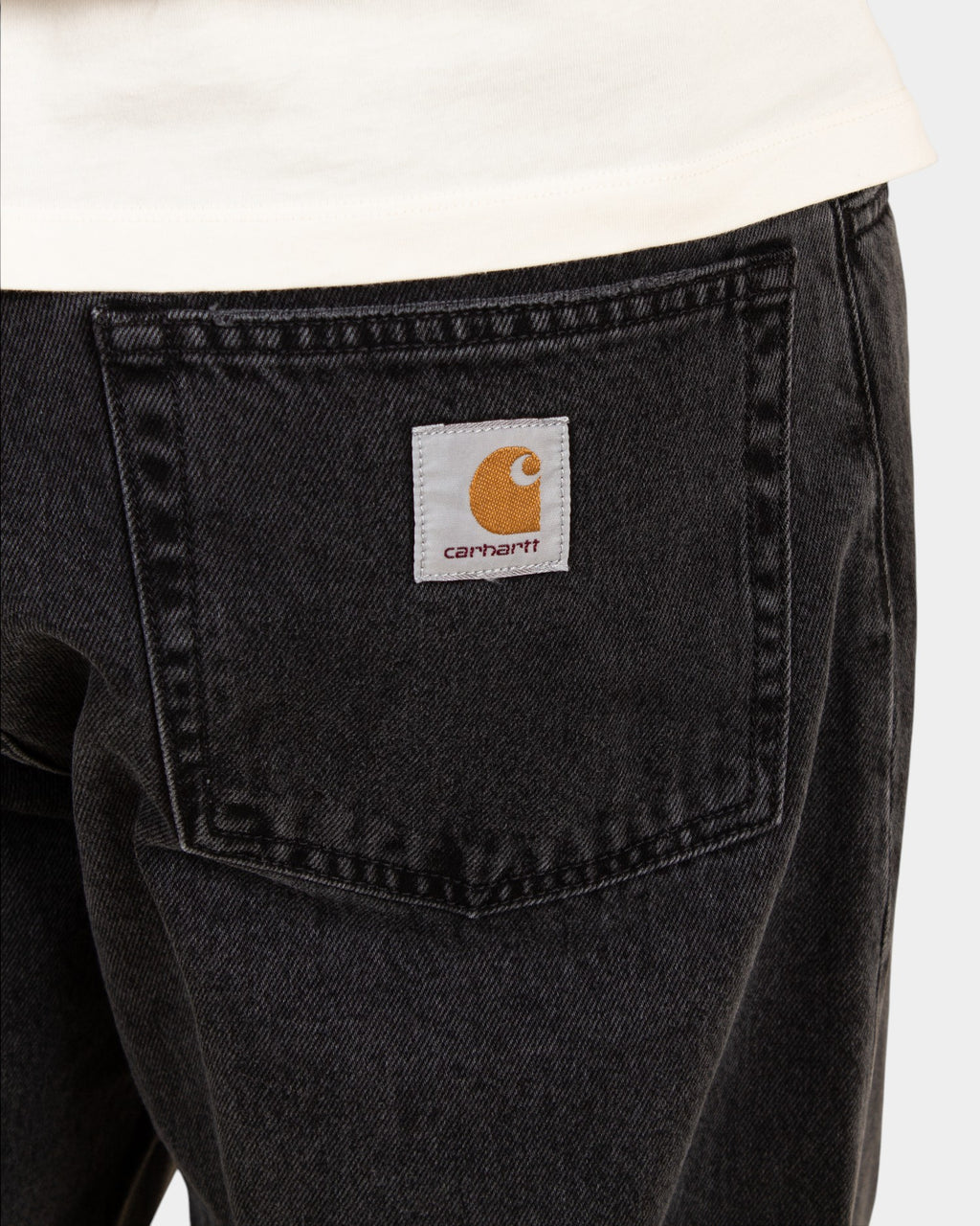 Lockwood Avenue Carhartt Landon pants in stone-washed black denim featuring a back pocket with square logo label