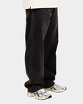 Lockwood Avenue Carhartt Landon loose tapered black stone-washed cotton denim jeans worn by a model
