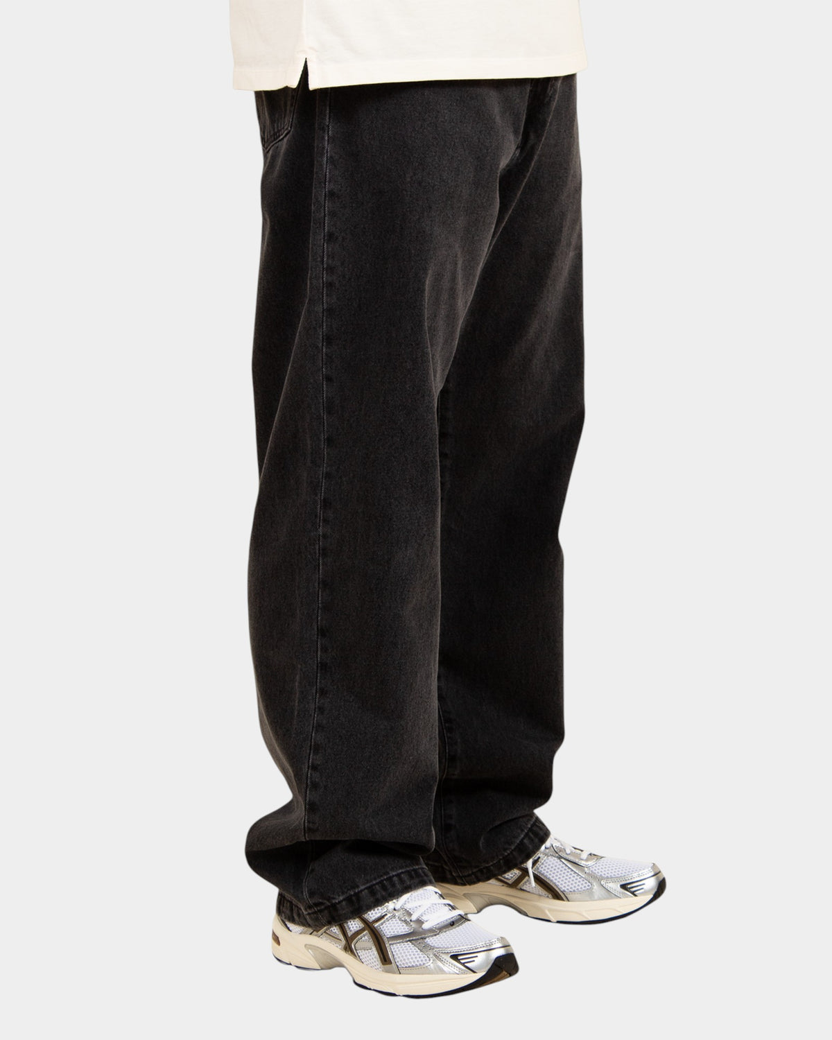 Lockwood Avenue Carhartt Landon loose tapered black stone-washed cotton denim jeans worn by a model