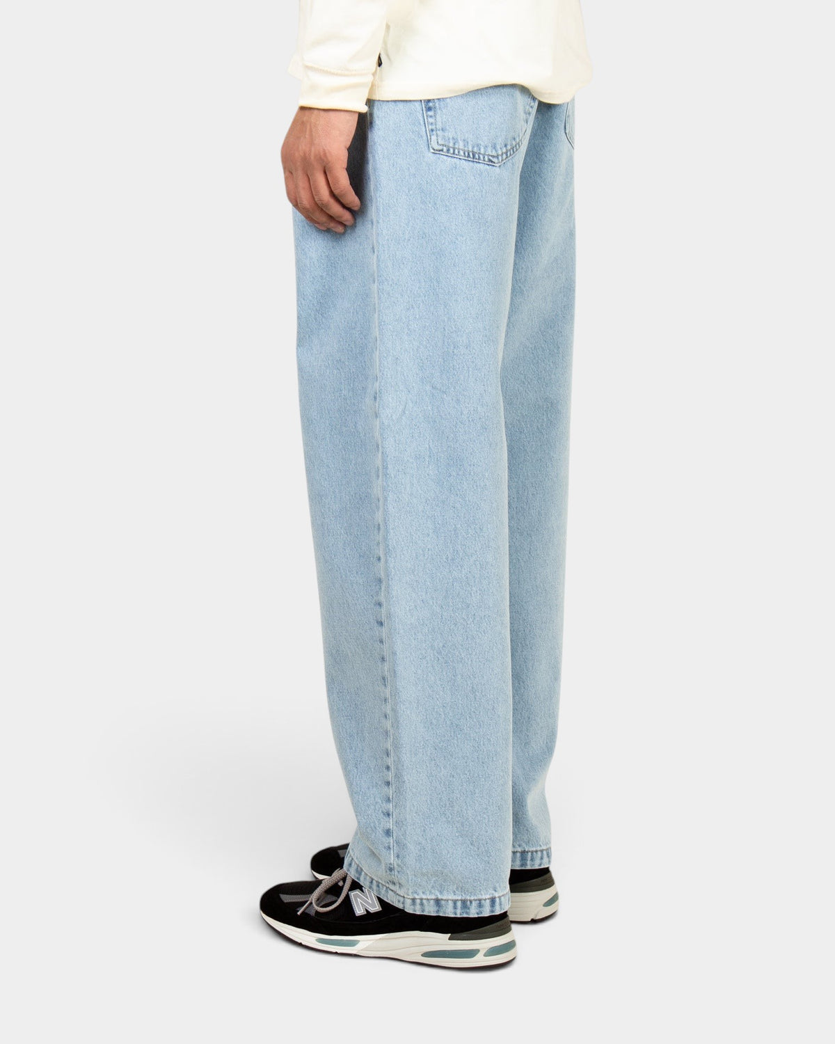 Lockwood Avenue Carhartt Landon loose tapered jeans in bleached light blue denim, side view on model