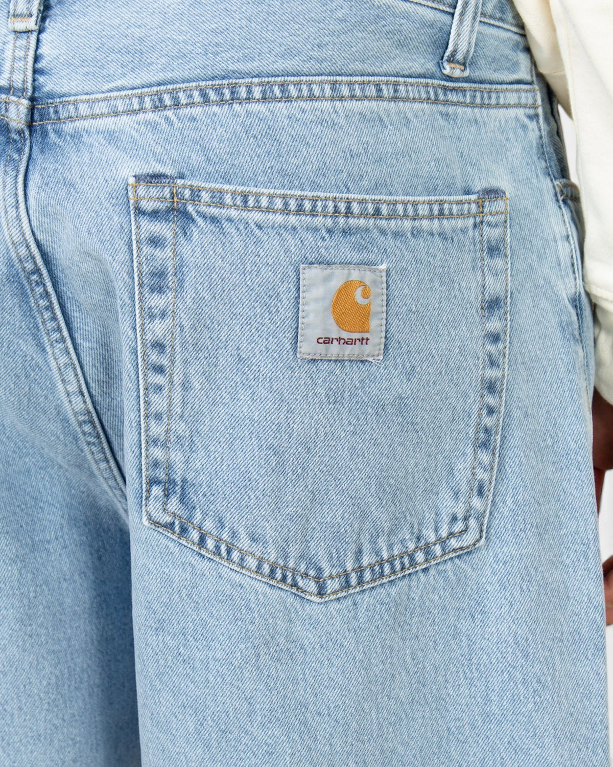 Lockwood Avenue Carhartt Landon pants in bleached blue denim featuring a square logo patch on the back pocket.