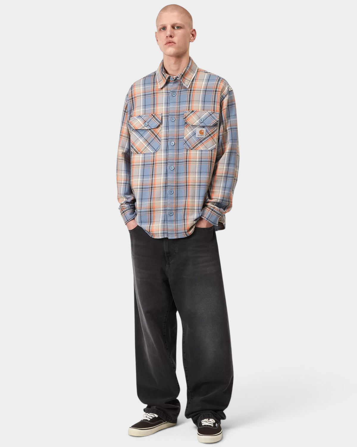 Lockwood Avenue Carhartt Landon pants in faded black bleached denim with a loose tapered fit on a male model