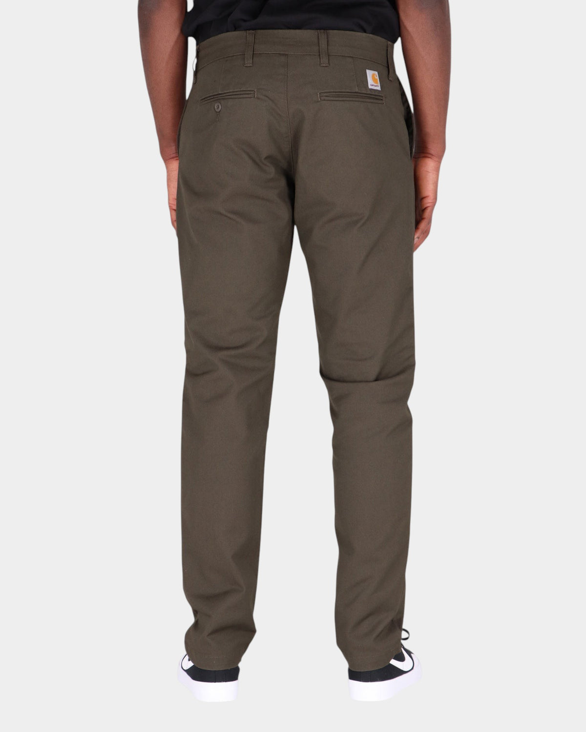 Lockwood Avenue Carhartt Sid slim tapered chinos in dark olive cotton twill, back view with square logo label
