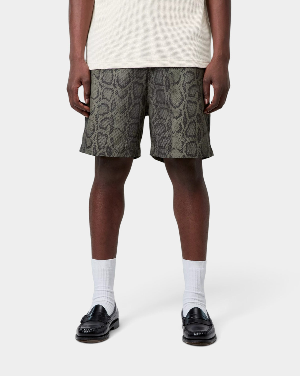 Lockwood Avenue Carhartt Slater swim shorts in grey snakeskin print polyester worn by a model with white socks.