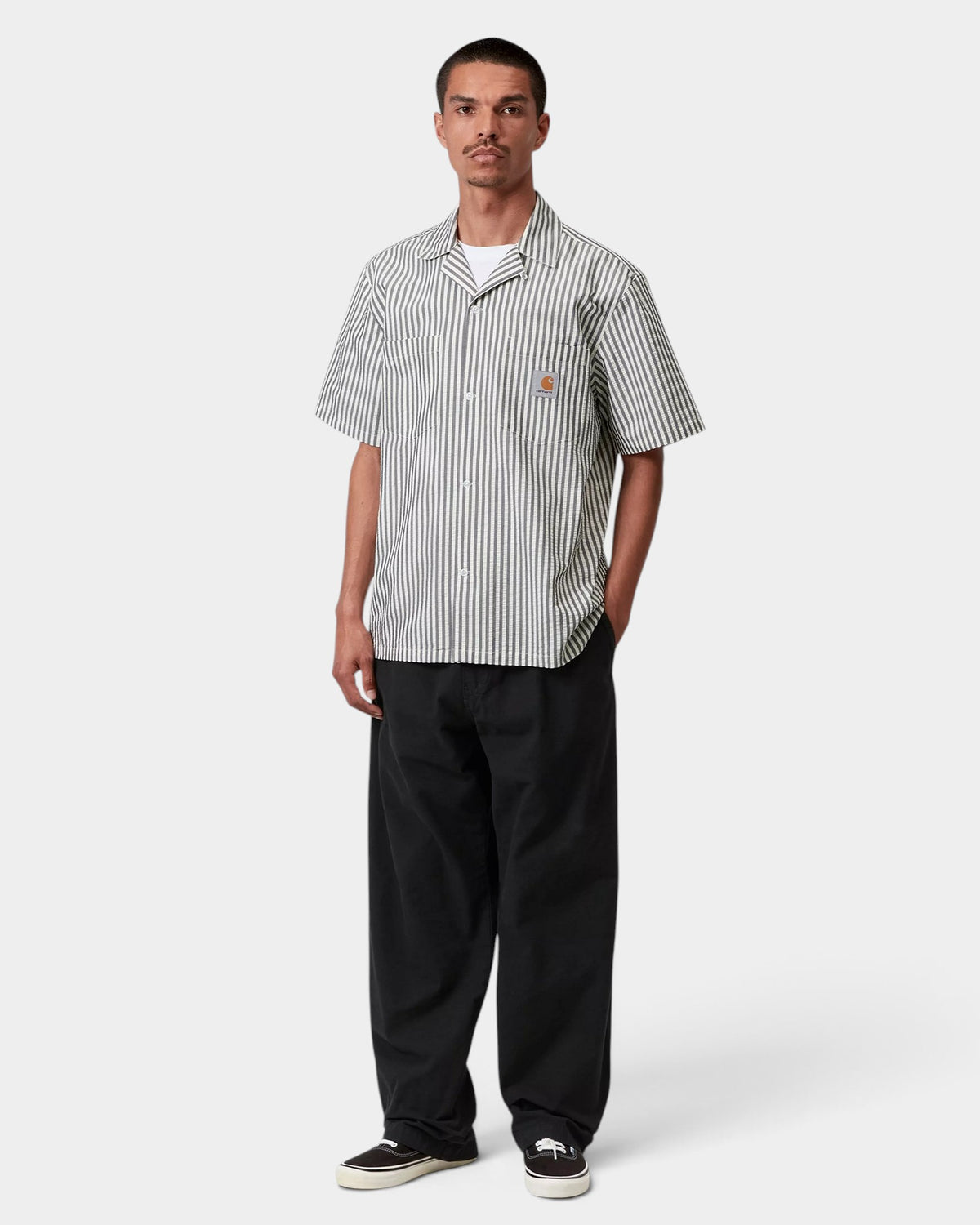 Lockwood Avenue model wearing black Carhartt Walton cotton canvas relaxed fit pants with an elasticated waistband.