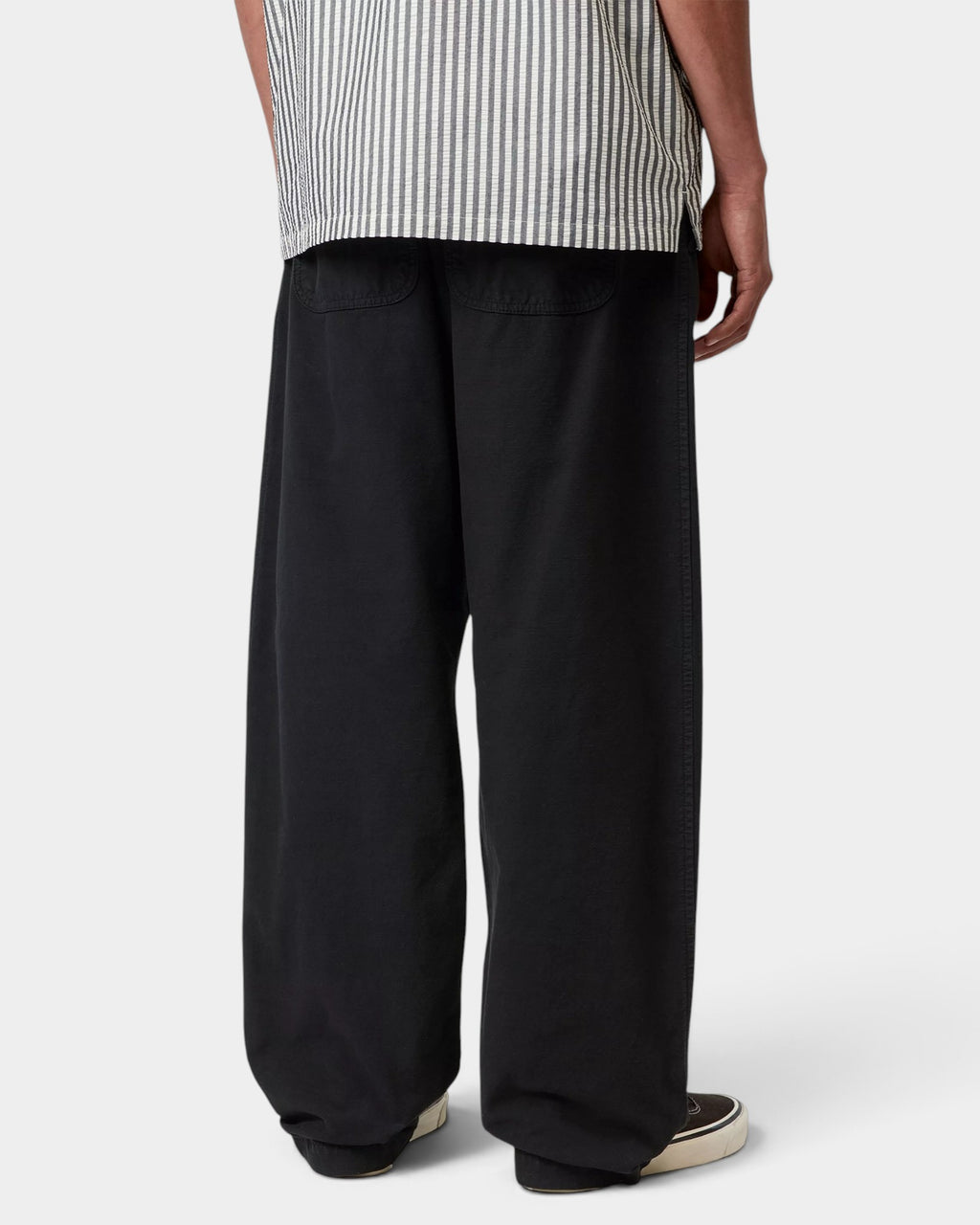 Lockwood Avenue Carhartt Walton black cotton canvas relaxed fit pants seen from the back on a model