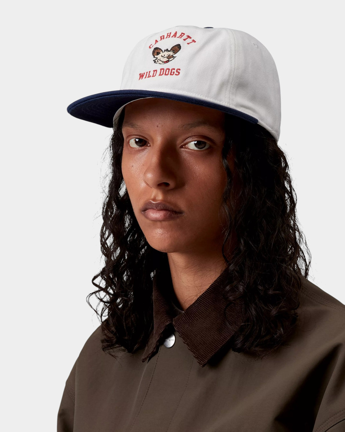 Lockwood Avenue Carhartt Wild Dog cap in white cotton twill with red graphic embroidery and a navy curved brim.