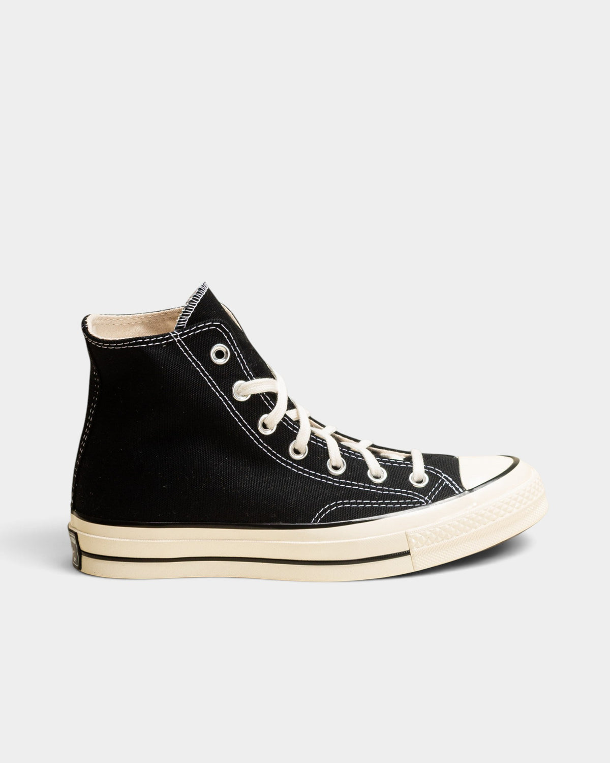 Lockwood Avenue Converse Chuck 70 Hi black canvas high-top sneakers with an egret rubber midsole and toe cap.