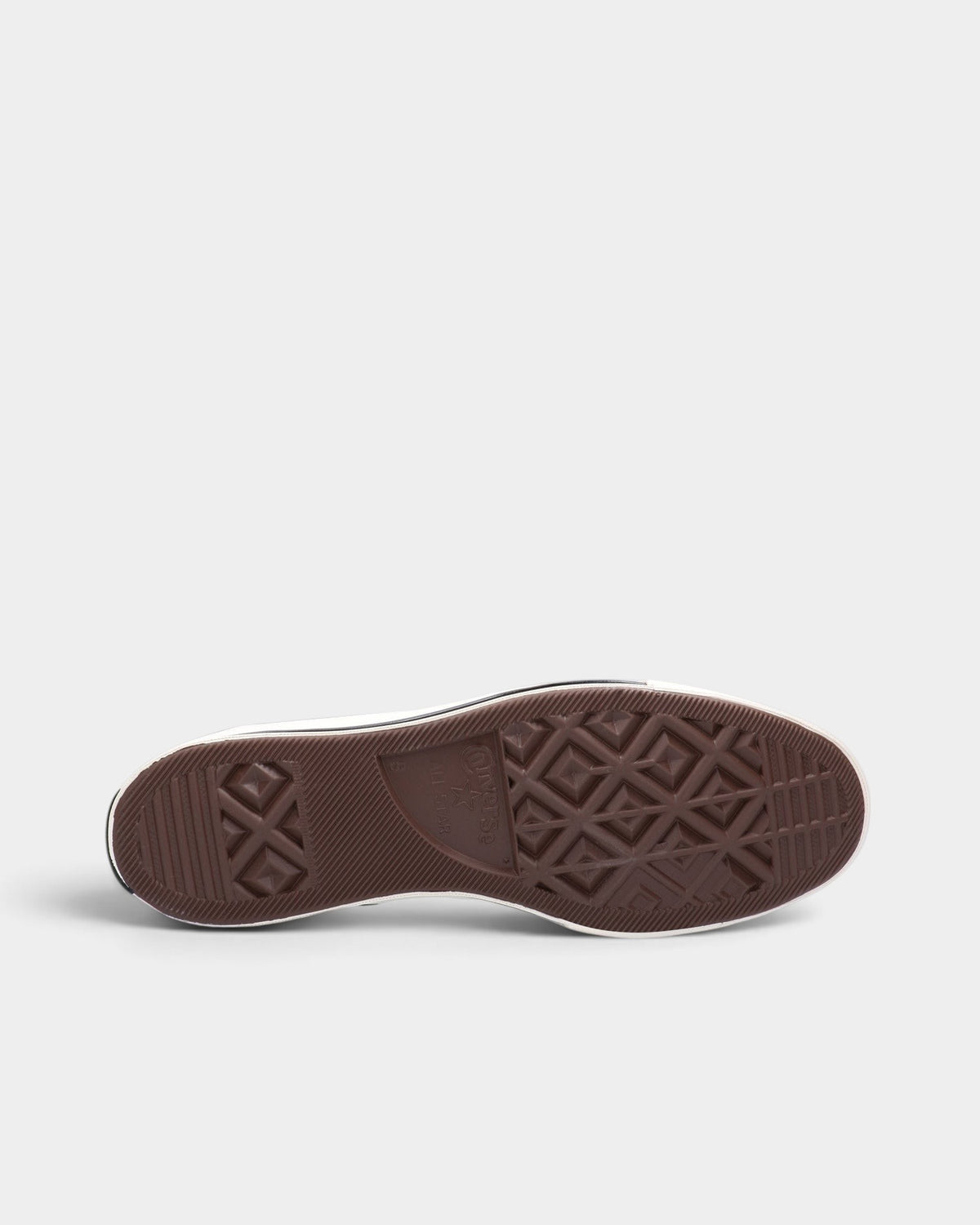 Lockwood Avenue Converse Chuck 70 low-top sneaker showing the brown vulcanized rubber outsole with diamond tread pattern